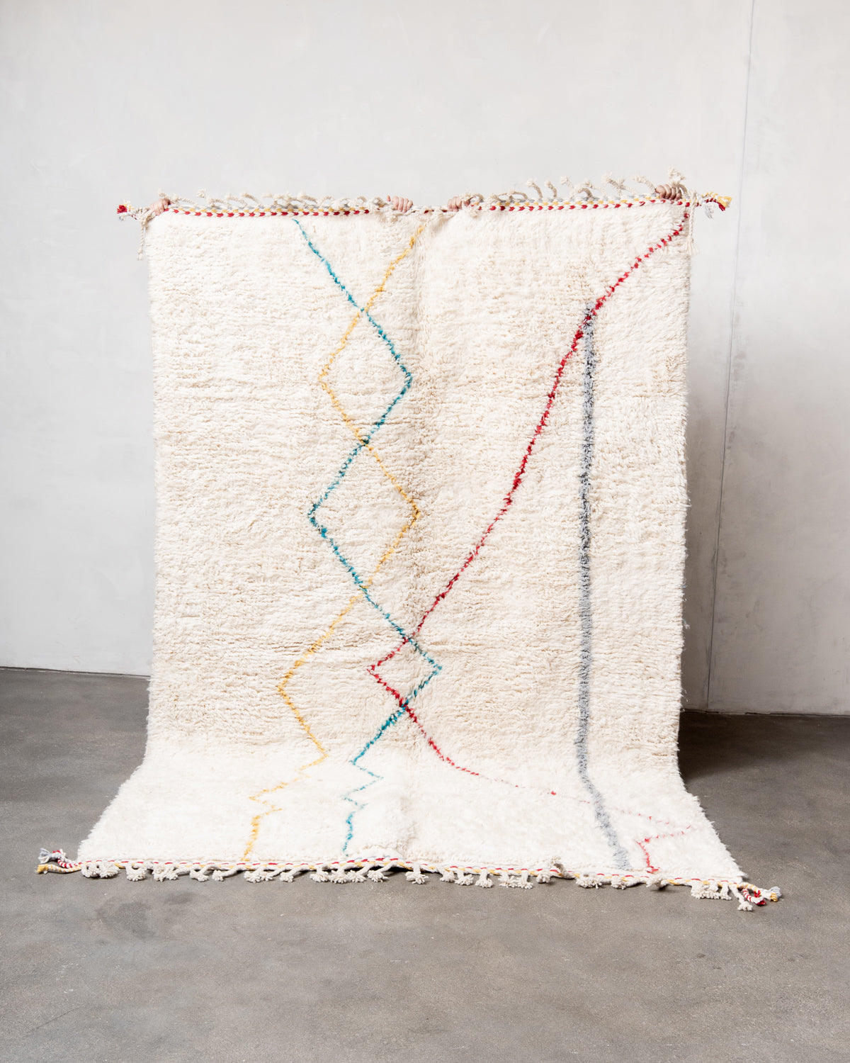 Modern, designer, handcrafted Berber rug from Morocco. Beniourain carpet with beautiful colours and patterns and fluffy wool texture.